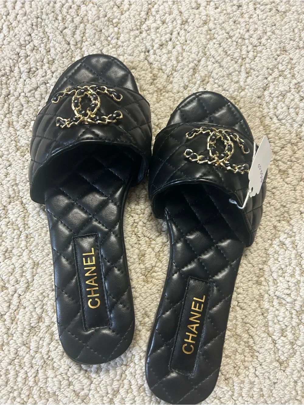 CHANEL Black Quilted Leather Slide Mules with Gold CC Chain